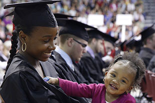 Photo of a graduate with her daughter. Link to Gifts from Retirement Plans.