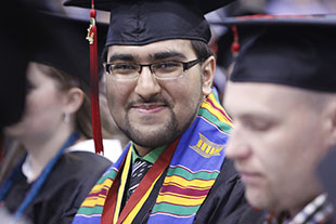 Photo of student at graduation. Links to Gifts of Cash, Checks, and Credit Cards