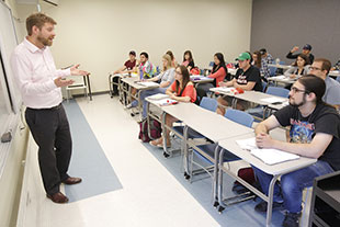 Photo of students in class. Link to Gifts That Pay You Income.