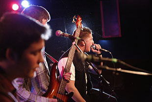 Photo of a band performing. Link to Tangible Personal Property.